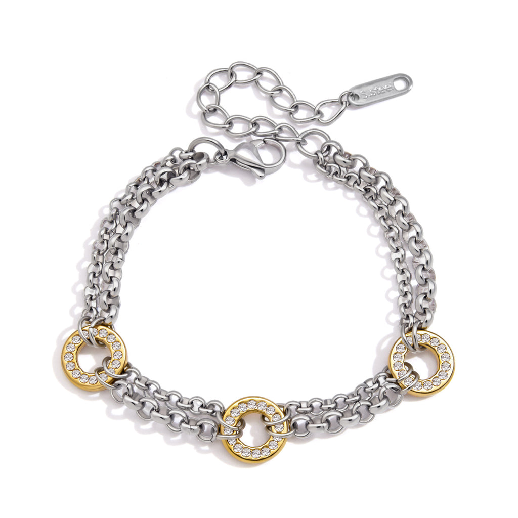 Tweekleurige zirkonia schakelarmband op witte achtergrond